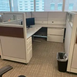 Global Evolve sit-stand workstation with clear glass toppers and wood-grain accent panels