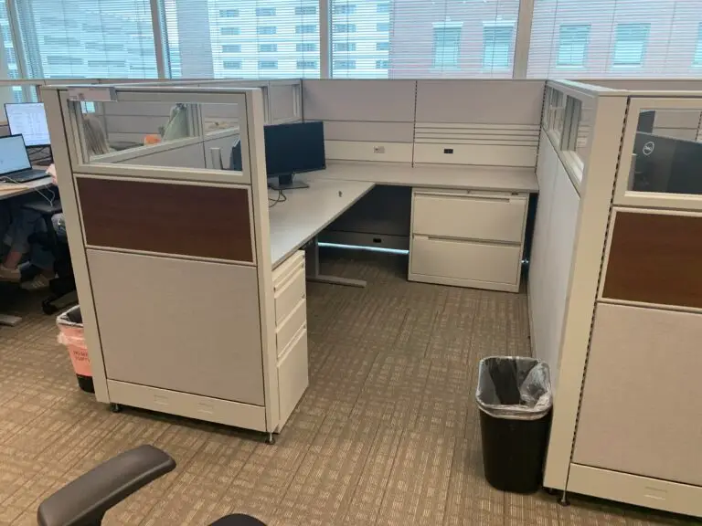 Global Evolve sit-stand workstation with clear glass toppers and wood-grain accent panels